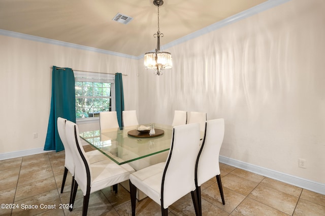 dining space featuring a notable chandelier, crown molding, and light tile patterned floors