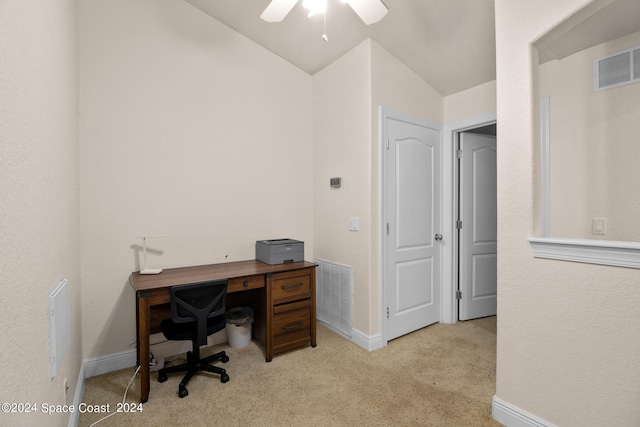 office area featuring ceiling fan, vaulted ceiling, and light colored carpet