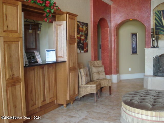 sitting room with light tile patterned floors