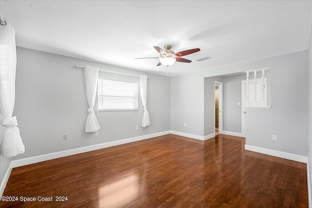 empty room featuring ceiling fan and hardwood / wood-style flooring