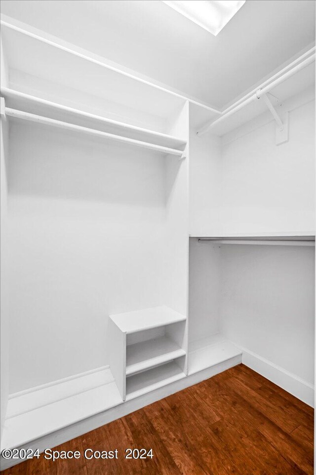 walk in closet featuring wood-type flooring