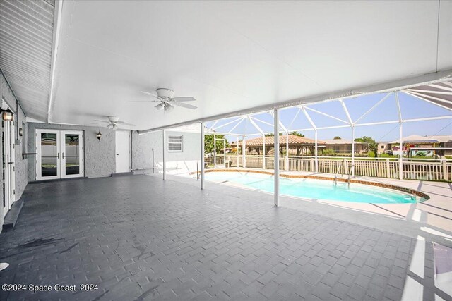 view of pool featuring ceiling fan, a patio area, and french doors