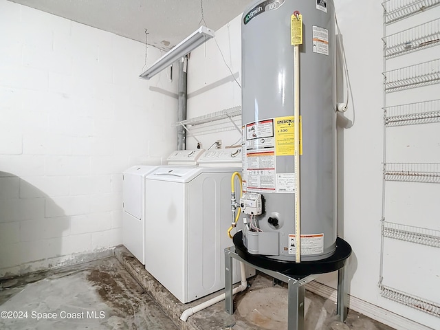 laundry room featuring gas water heater and independent washer and dryer