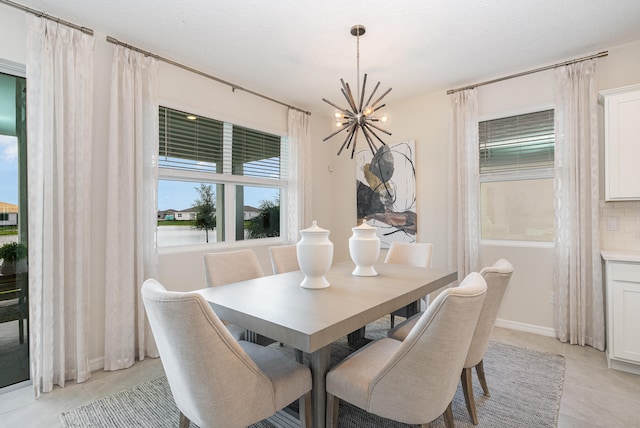 tiled dining space with a notable chandelier