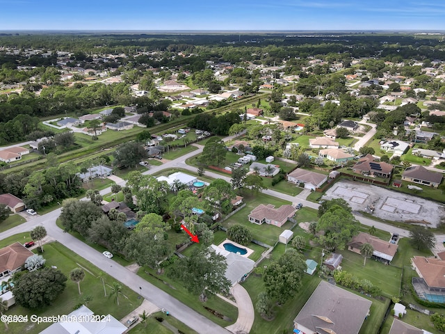 birds eye view of property with a residential view