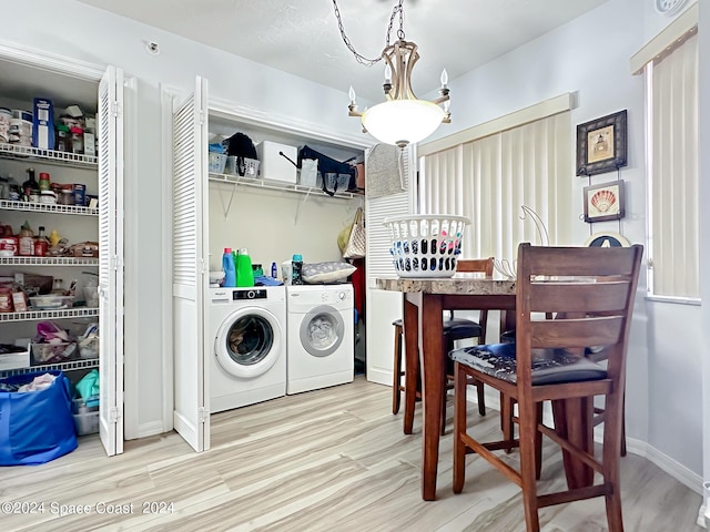 laundry room featuring light hardwood / wood-style flooring and independent washer and dryer