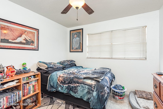 bedroom featuring ceiling fan and light tile patterned floors