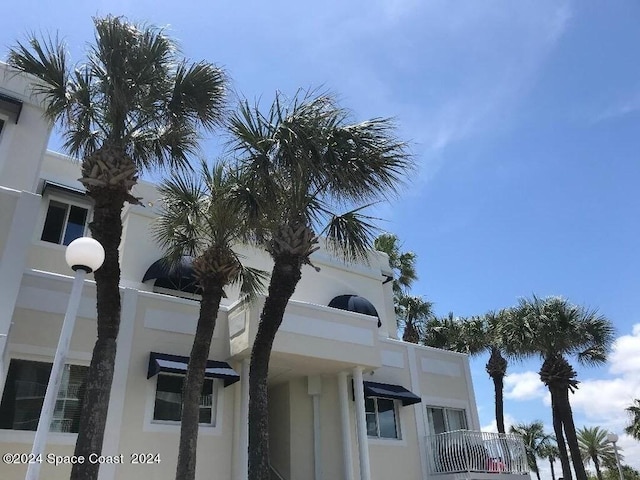 8600 Ridgewood Ave N Unit 1313, Cape Canaveral, FL 32920 - view of side of home featuring stucco siding