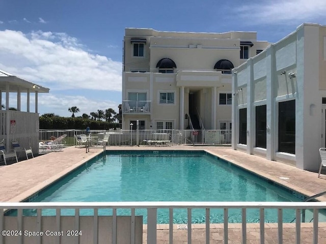 8600 Ridgewood Ave N Unit 1313, Cape Canaveral, FL 32920 - community pool with a patio