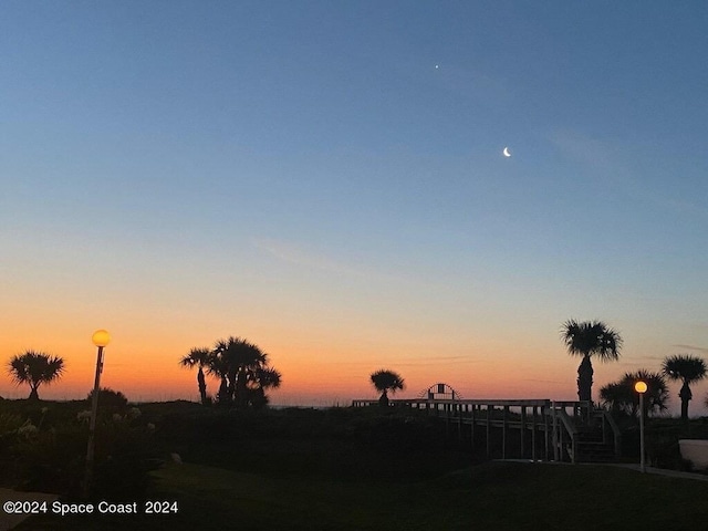 8600 Ridgewood Ave N Unit 1313, Cape Canaveral, FL 32920 - view of yard at dusk