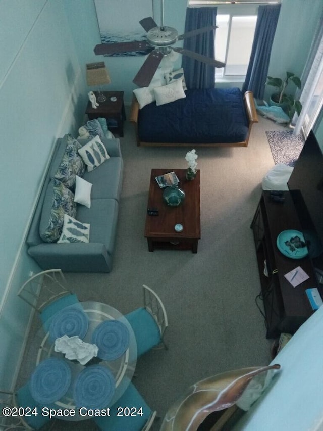 8600 Ridgewood Ave N Unit 1313, Cape Canaveral, FL 32920 - carpeted living area featuring a ceiling fan