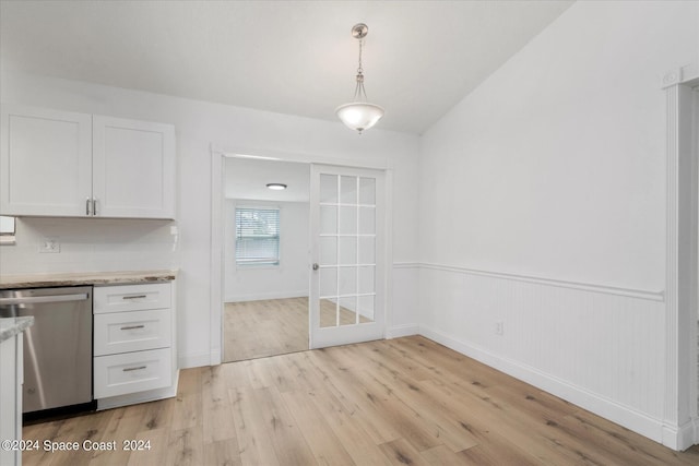 unfurnished dining area with light wood-type flooring