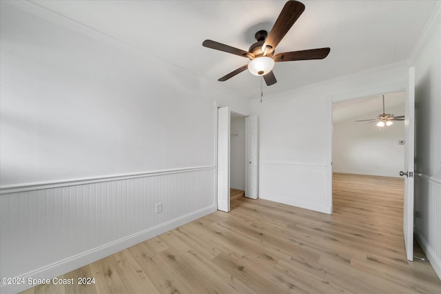 unfurnished bedroom with ceiling fan, ornamental molding, and light hardwood / wood-style floors