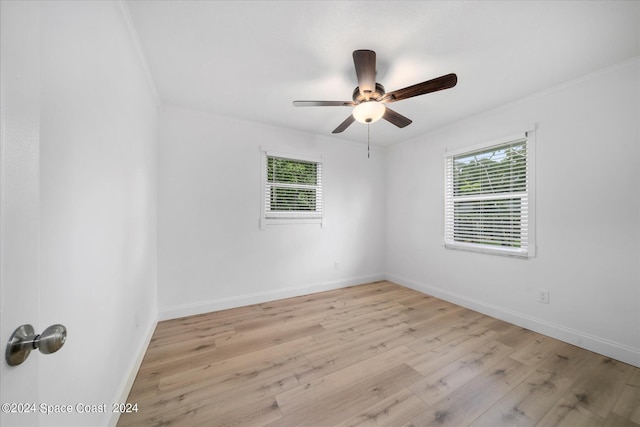 unfurnished room with crown molding, ceiling fan, and light hardwood / wood-style flooring