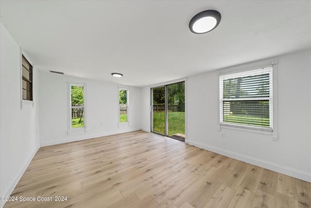 spare room with light wood-type flooring