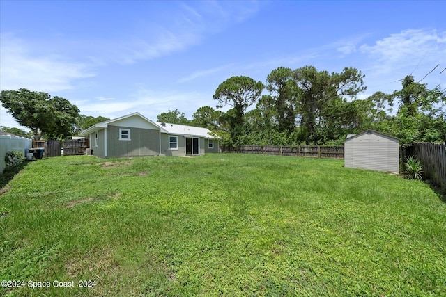 view of yard with a storage unit