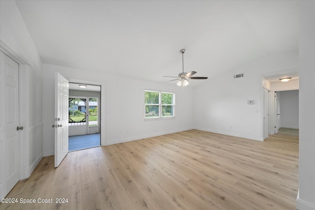 unfurnished room with ceiling fan, light hardwood / wood-style floors, lofted ceiling, and a wealth of natural light