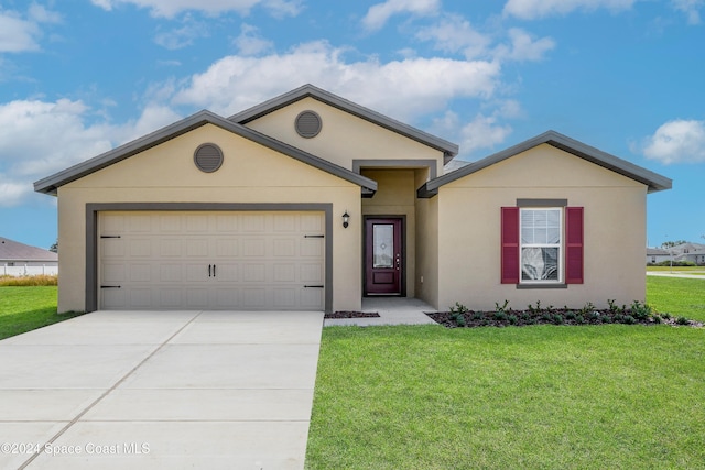 ranch-style house featuring a front yard, driveway, an attached garage, and stucco siding