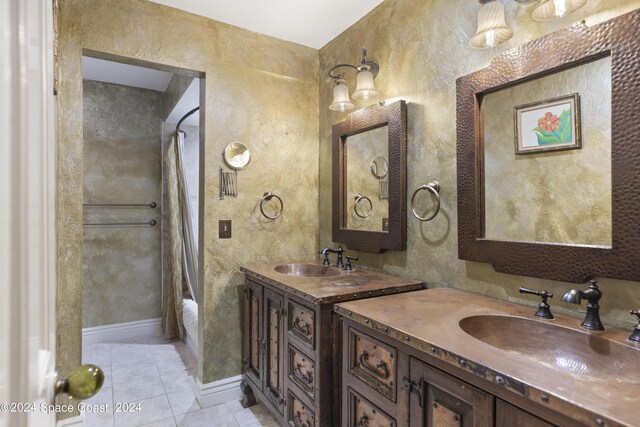 bathroom with tile patterned flooring, vanity, and shower / bath combo