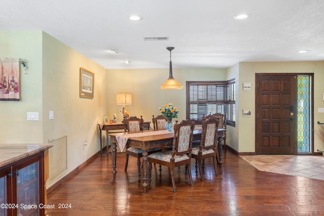 dining space featuring dark hardwood / wood-style floors