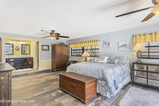 bedroom with ceiling fan and hardwood / wood-style floors