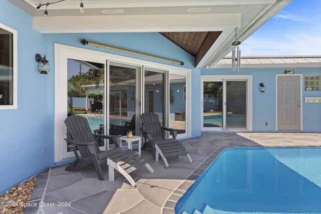 view of pool featuring a patio