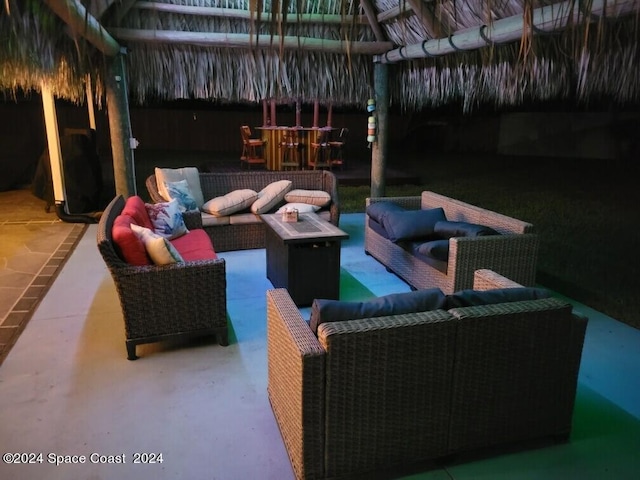 view of patio / terrace with a gazebo and an outdoor living space with a fire pit