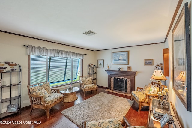 living area featuring dark hardwood / wood-style floors and ornamental molding