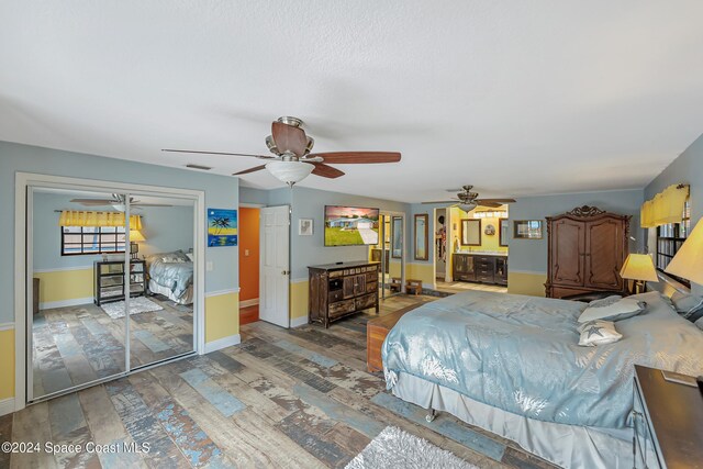 bedroom featuring hardwood / wood-style floors, a closet, and ceiling fan