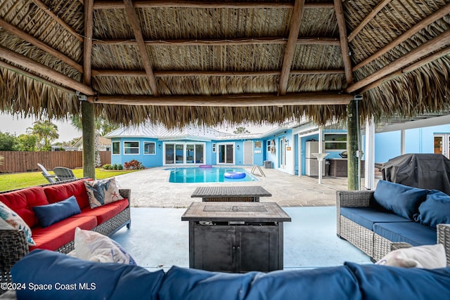 view of swimming pool featuring a gazebo, an outdoor hangout area, and a patio