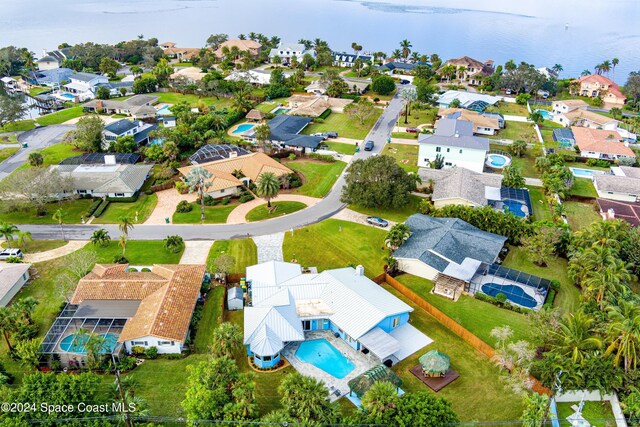 birds eye view of property featuring a water view