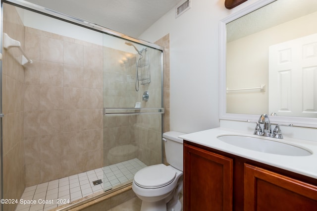 bathroom featuring walk in shower, vanity, and toilet