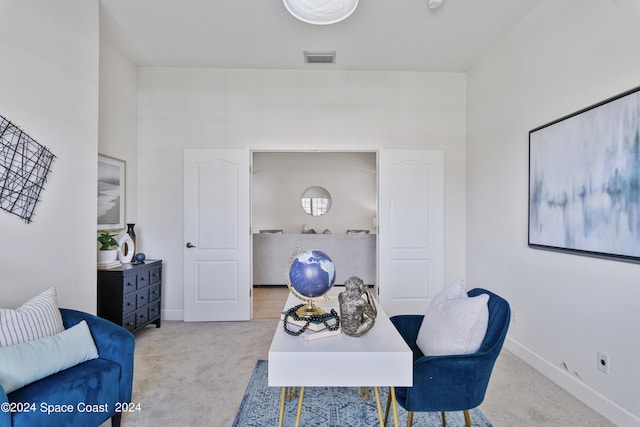 carpeted office space with visible vents and baseboards