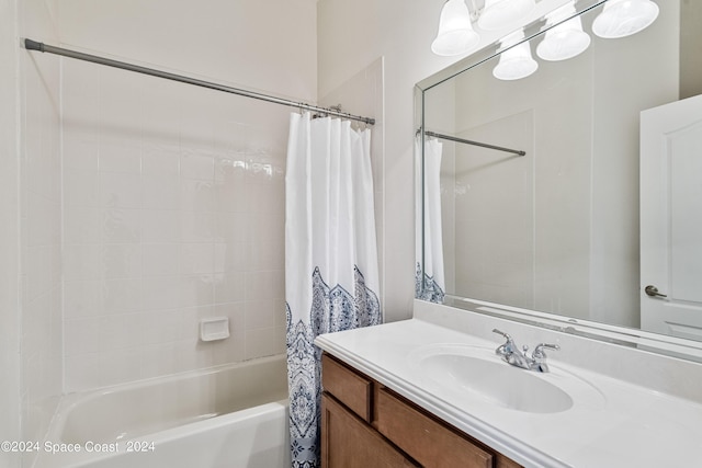 full bath featuring vanity and shower / bath combo with shower curtain