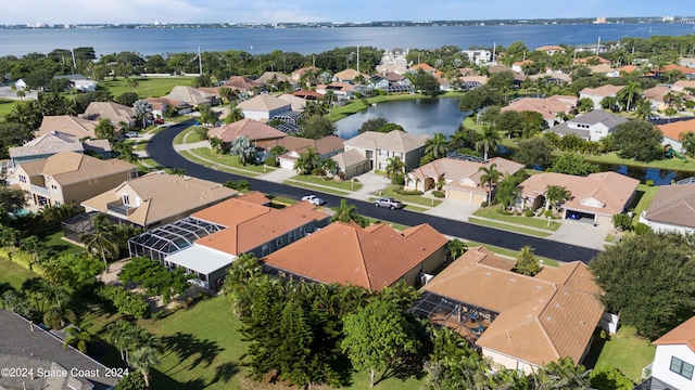 bird's eye view featuring a water view and a residential view