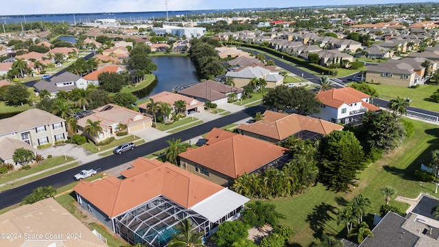 aerial view featuring a residential view and a water view