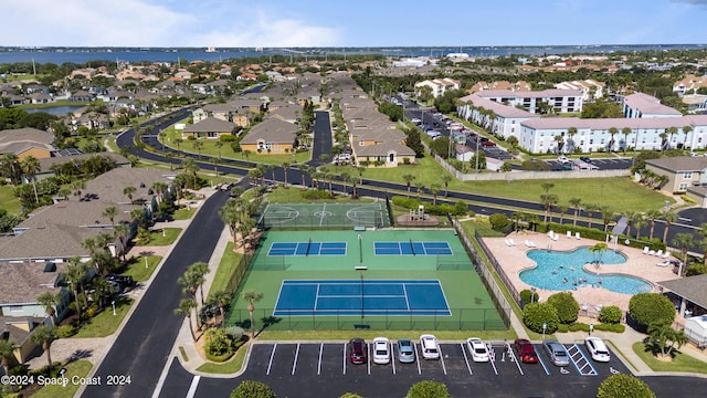 bird's eye view with a water view and a residential view