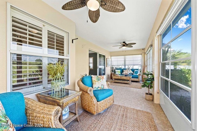 sunroom featuring a ceiling fan