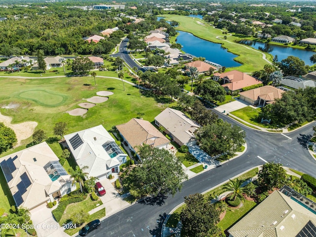 bird's eye view featuring a water view and a residential view