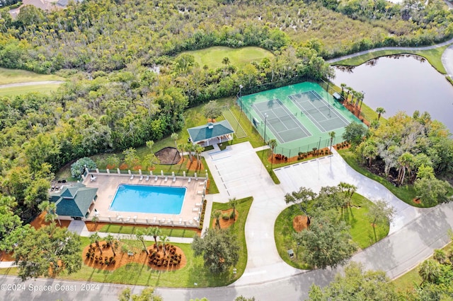 birds eye view of property with a water view