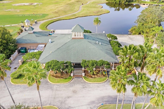 aerial view with view of golf course and a water view