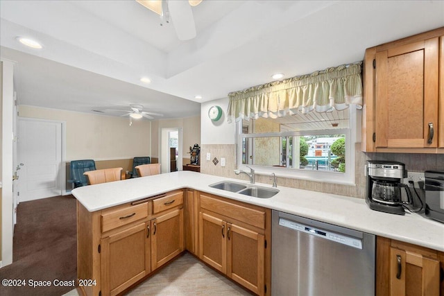 kitchen featuring ceiling fan, stainless steel dishwasher, sink, and a healthy amount of sunlight