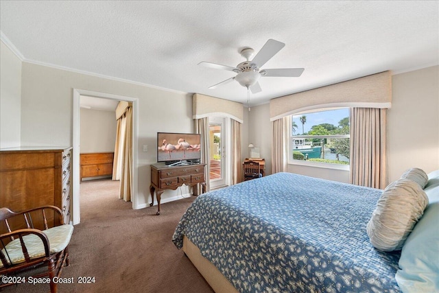 carpeted bedroom with a textured ceiling and ceiling fan