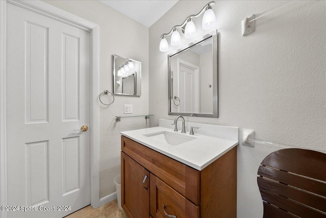 bathroom with tile patterned floors and vanity