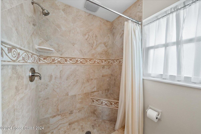 bathroom with a shower with shower curtain