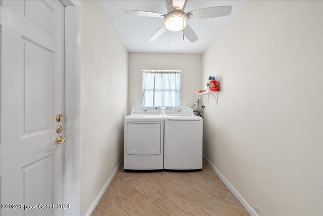 clothes washing area featuring ceiling fan and separate washer and dryer