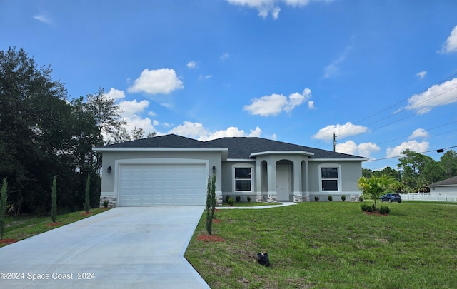 view of front facade with a garage and a front yard