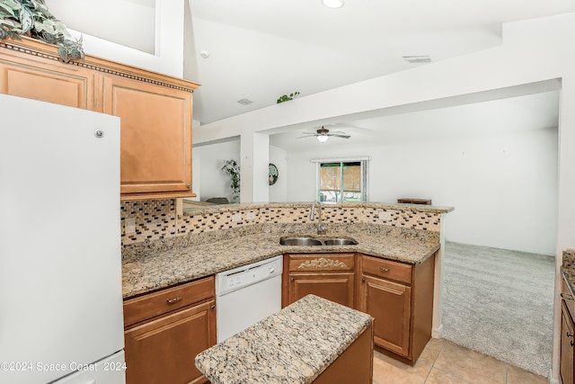 kitchen with backsplash, sink, light tile patterned floors, white appliances, and ceiling fan