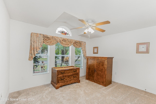 carpeted bedroom featuring ceiling fan and vaulted ceiling