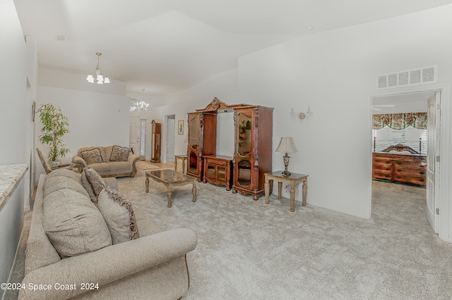 carpeted living room featuring a notable chandelier